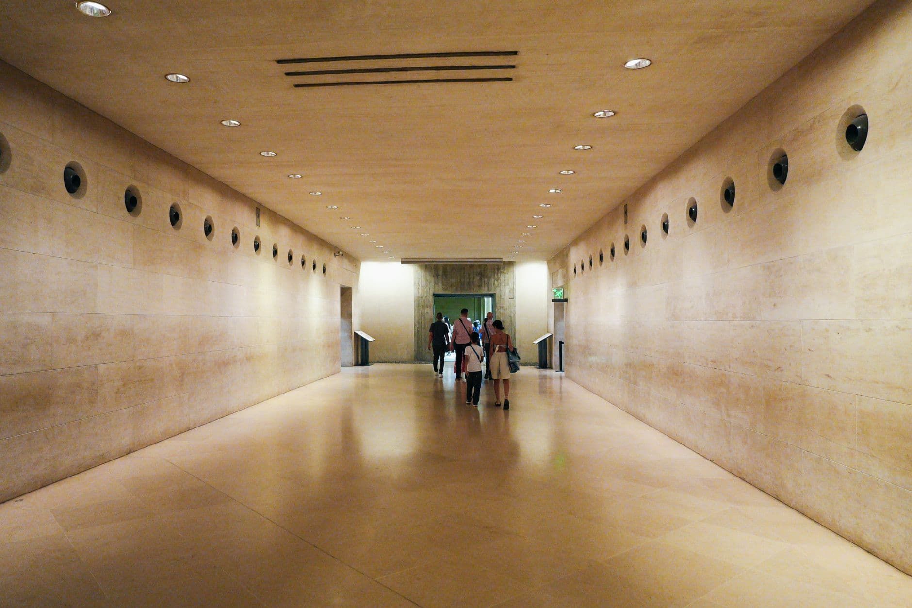 A quiet stone treatment room lit by soft daylight